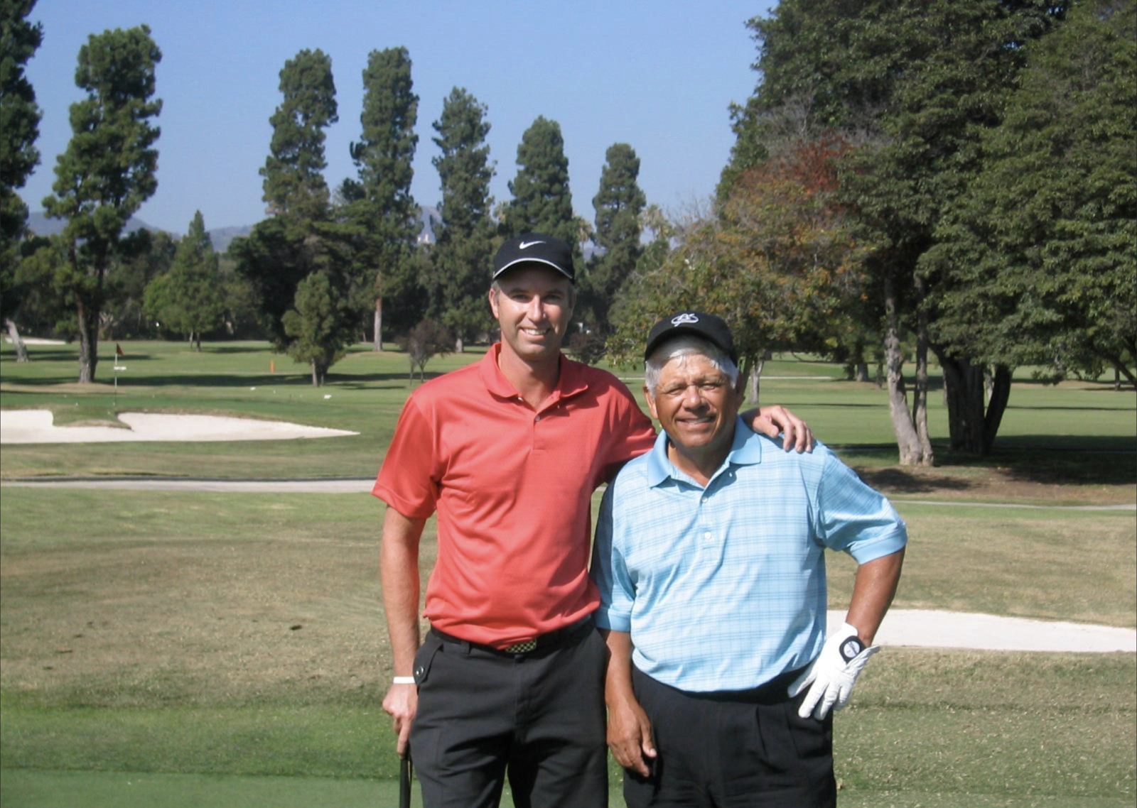 Paul Parlane with Lee Trevino on the golf course
